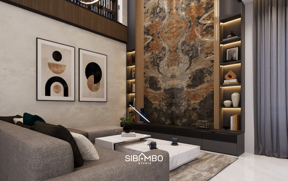 Ruang keluarga The Tranquil House dengan dinding granit premium dan tone hangat pada rumah modern kontemporer