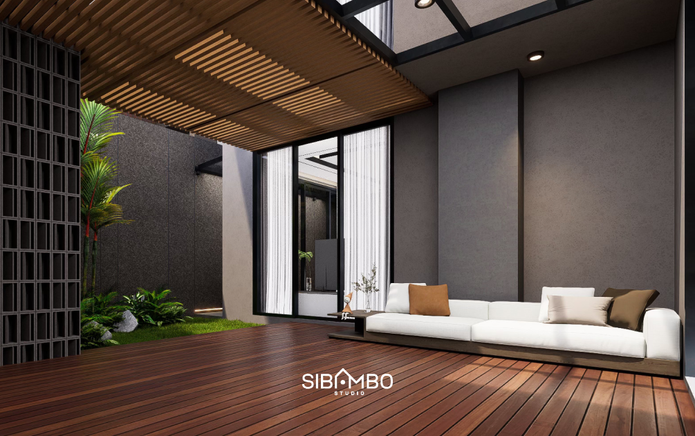 Area santai indoor-outdoor The Tranquil House dengan decking kayu dan taman pada rumah modern Bandung