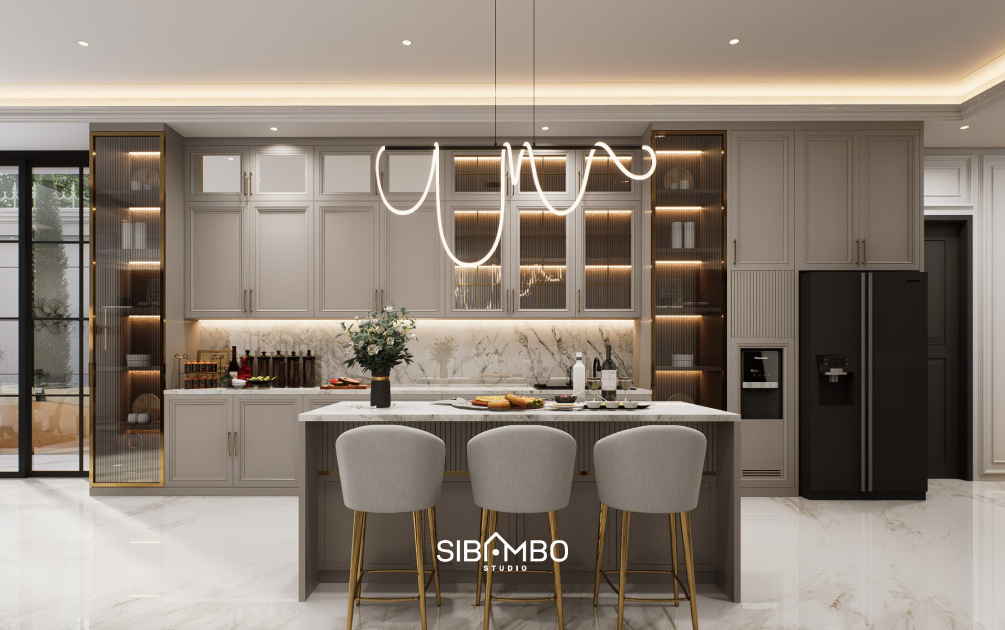 Dapur Harmonie Residence dengan island marmer dan kabinet klasik bernuansa mewah di Tangerang