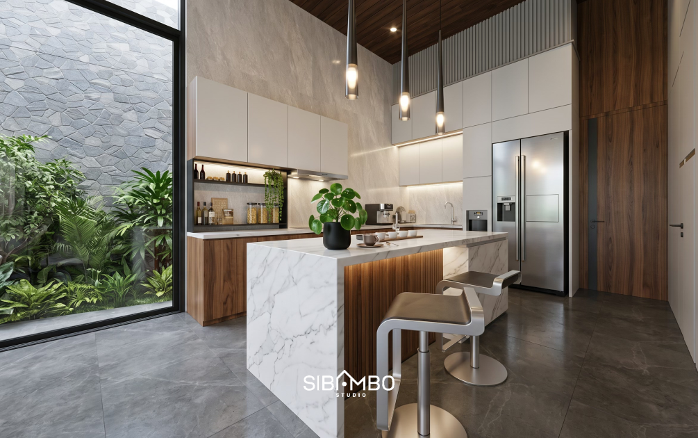 Dapur Mellifera Palace dengan island marmer dan void tinggi menghadap taman bernuansa natural di Bontang